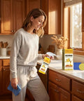Woman using Beeswax Furniture Polish And Cleaner With Quick Fix Wood Repair Stick For All Wood Types Tables And Cabinets Restore Natural Shine Remove Dullness And Grime In One Easy Spray Wipe Clean No Fuss in kitchen.