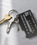 Mini Vernier Caliper Keychain with keys, portable millimeter gauge with double scale, black, lightweight plastic construction