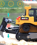 Side view of Proportional One Sixteenth Scale RC Bulldozer Toy with four wheel drive and metal shovel showing remote control features.