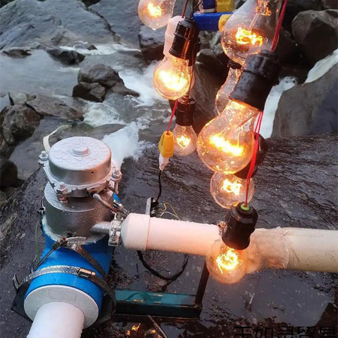1000W Micro Hydro Generator For Outdoor Use Hydroelectric Water Turbine With 220V Output Portable Water Powered Generator For Camping And Off Grid Power Ready To Go installed by river with glowing bulbs