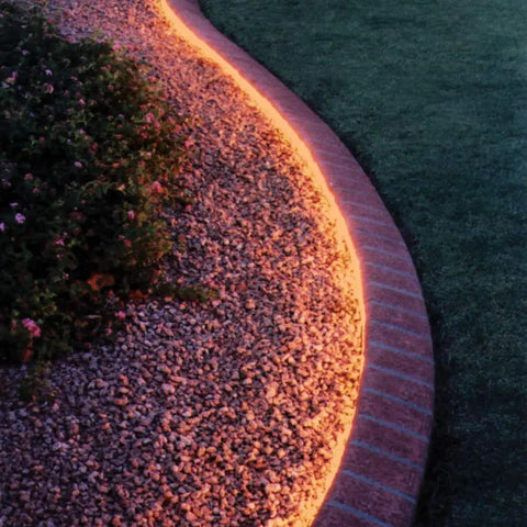 Curved garden path illuminated by Universal 120 Watt Dimmable 12V DC LED Driver with smooth flicker-free dimming