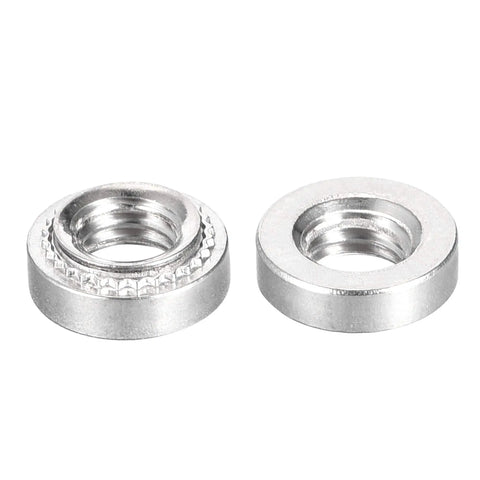 Built Different Stainless Steel Self Clinching Rivet Nuts With Smooth Round Head For Fast Thin Sheet Metal Assembly 10 32 Thread Pattern Zero Point One Four Inch Length Heavy Duty 50 Piece Fastener Set That Goes Hard On Any Rig showing two nuts.