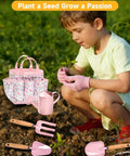 Eight Piece Kids Gardening Tool Set With Shovel Rake Watering Can Hat Apron Gloves And Storage Bag Pink Flower Theme in use by toddler