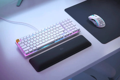 Full Size Prebuilt Mechanical Gaming Keyboard Featuring Compact 96 Layout In Crisp White Design With Silky Smooth Linear Switches Durable Abs Keycaps Reliable Double Shot Legends And Stunning Per Key Rgb Backlighting For A Dope Home Or Office Setup on a desk with a black mouse pad and gaming mouse.