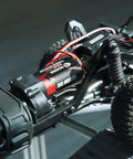 Close-up of 180 Brushed 55T RC Motor With Stainless Steel Pinion for TRX4M Crawler Upgrades Defenders Bronco K10 F150, installed.