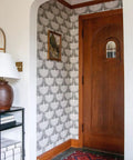 Chalk Feather Flock Peel And Stick Wallpaper Two Pack 20.5 Inches By 16.5 Feet Light Gray And Off White Made In The USA Genevieve Gorder Collab displayed in a stylish entryway