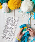 Super Crisp Acrylic Gauge Ruler For Knitting And Crochet No Sweat Stitch Measurement Guide With Transparent Grid over yarn and knitted fabric.