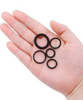 Universal Pressure Washer O Ring Kit, 100 Piece Replacement Rubber Seals shown in hand for size comparison.