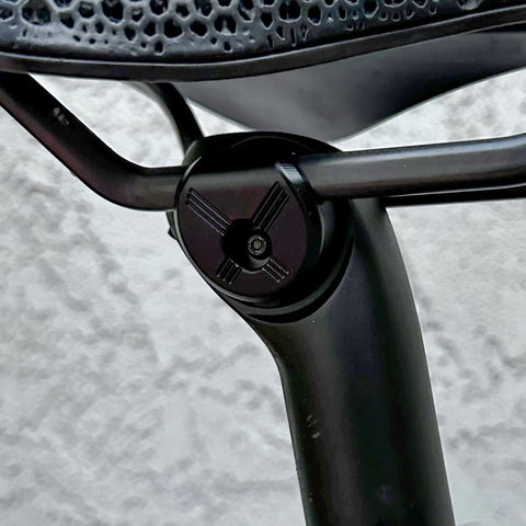 Close-up of 7x10 Seatpost Ear Clamp Titanium Bolt Kit For Oval Carbon Rails installed on a seatpost.