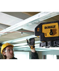 Professional Grade Self Leveling Laser Level Built Tough For The Jobsite Straight Shooting Five Beams Cross Line Layout Tool in use overhead.