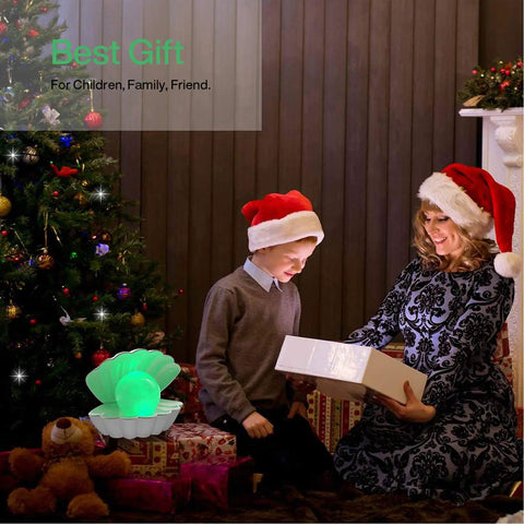 Child and woman with Christmas gift beside Shell Pearl Beach Themed Night Light With 8 Color RGB Mood Lighting Clamshell Bedside LED Lamp