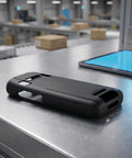 Tough As Nails Nonslip Boot With Crush Proof Armor And Tight Fit For K3S Barcode Scanner resting on a warehouse counter.