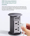 Slick Auto Rising Desk Power Strip With Fast Wireless Charger Tempered Glass Top visible with USB ports and plug insertion.