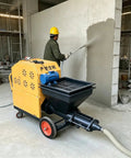 Heavy Duty Portable Construction Mortar Spraying Machine spraying plaster on wall, portable, efficient for wall rendering.