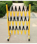 Flexible Expandable Safety Fence With Smooth Rolling Casters For Crowd Control And Room Dividing near outdoor path with yellow and black design.