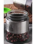 600 Milliliter Airtight Glass Coffee Storage Jar With Stainless Steel Lid Locks In Aroma For Beans Grounds Tea And Nuts with dried rose buds.