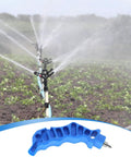 2-In-1 Drip Irrigation Hole Punch And Fitting Insertion Tool Kit with blue handle and sprinkler system in garden
