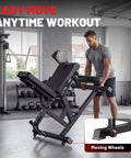 Man adjusting 4 In 1 Leg Extension And Curl Machine for Home Gym with 800 LB capacity, showing moving wheels feature.