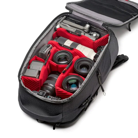 Open Frontloader M Pro Camera Backpack with Side and Front Access Tripod Mount Padded Interchangeable Dividers and camera gear inside.