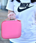 Person holding Pink Universal Case For LED Neck Reading Light, Portable Storage Holder For USB Cable And Book Light