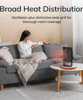 Ellipse Ceramic Tabletop Heater With Tip-Over Switch And Child Lock Digital Display Thermostat Auto Eco Mode Wide Oscillation Remote 1500W Black in a cozy living room setting, placed on a white coffee table, radiating warmth.