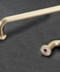 10 Pack 5 Inch Center To Center Brushed Brass Kitchen Cabinet Pulls Zinc Alloy Solid Round Handles shown on dark surface