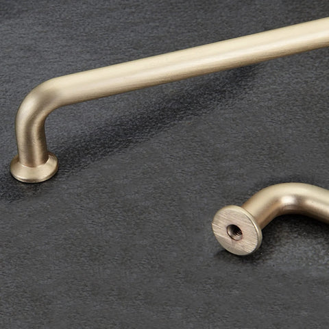 10 Pack 5 Inch Center To Center Brushed Brass Kitchen Cabinet Pulls Zinc Alloy Solid Round Handles shown on dark surface