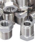 No Nonsense Heavy Duty Stainless Steel 316 Hex Bushing Reducer 1/2 Male NPT To 1/4 Female Pipe Fitting Solid Core Bulk Pack Of 150 Pieces stacked together.