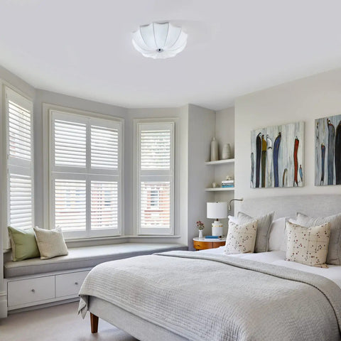 White Fabric Drum Shade Flush Mount Ceiling Light Fixture in bedroom with modern decor and cozy ambiance