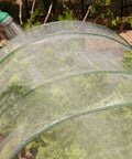8Ft X 10Ft Garden Netting For Plant Protection And Insect Barrier installed over lettuce plants, showing fine UV-resistant PE mesh