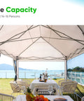 Interior view of 10x20 Pop Up Screened Canopy Tent With Mosquito Netting, set up for outdoor dining, overlooking a scenic view