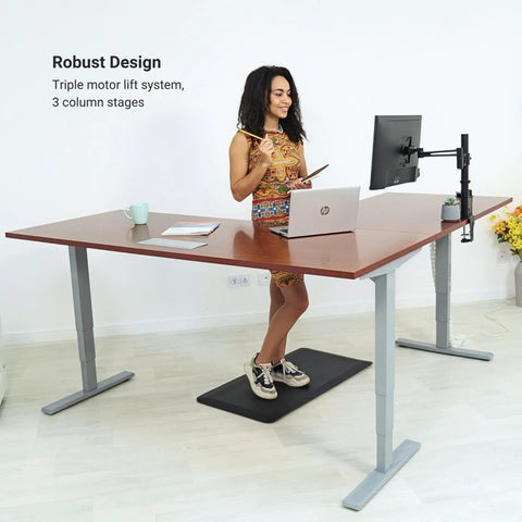 Game Changer Electric Lift L Shaped Standing Desk 88 Inch Wide with ergonomic setup, triple motor lift, and sturdy steel base.
