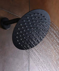 Matte Black Shower Faucet Set With Pressure Balance Cartridge And 8-Inch Rain Shower Head spraying water in bathroom.