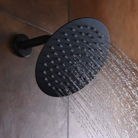 Matte Black Shower Faucet Set With Pressure Balance Cartridge And 8-Inch Rain Shower Head spraying water in bathroom.