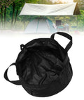 Collapsible Water Bucket For Camping And Travel Foldable Wash Basin with storage bag against outdoor tent setup