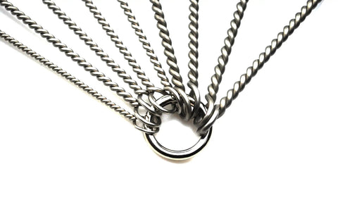 Close-up of twisted stainless steel wires from a pipe cleaning brush set, 8 piece variety pack for auto parts, bottles, and tubes.
