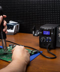 Maker Friendly Pro Grade Hot Air SMD Soldering Rework Station with Quick Change Nozzle System in use on circuit board