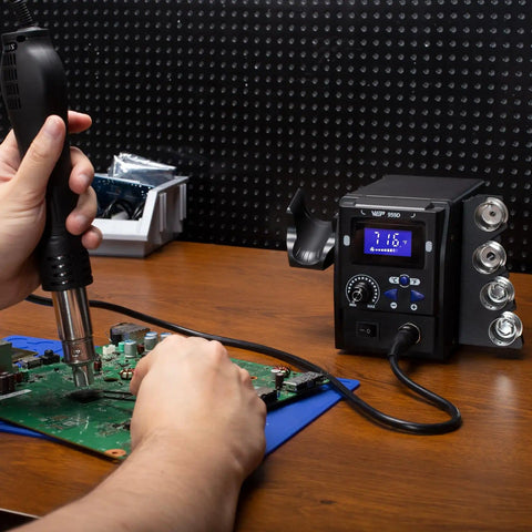 Maker Friendly Pro Grade Hot Air SMD Soldering Rework Station with Quick Change Nozzle System in use on circuit board