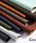 Rolled sheets of various colored PU leather, including green, brown, black, and cream, displayed horizontally.