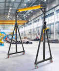 Heavy Duty Portable Gantry Crane 2 Ton 4400 Lb Load Capacity adjustable lift rig in industrial warehouse setting.