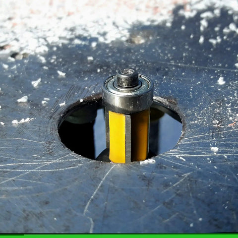 Close-up of a carbide-tipped router bit in use, showcasing sharp edges and smooth finishes for woodworking in all wood types.