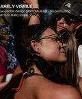 Person wearing Music Pro Concert Ear Plugs That Keep Your Ears Safe And Your Sound Clean For Gigs And Live Events Up To 20dB Noise Reduction, Reusable Ear Plugs With Filter Set And Case in ear at concert