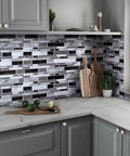 Peel And Stick Backsplash Wallpaper For Kitchen With 3D Look Tile Contact Paper Waterproof No Fuss Easy To Clean Oil Proof Heat Resistant 17.7In X 196.8In 24.22 Sq Ft Roll applied in kitchen with gray cabinets and cutting board.