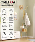 Coat Rack With 12 Hooks Freestanding Hall Tree In Gold Finish Dope Modern Industrial Style Entryway Organizer With Two Wooden Shelves For Clothes Hats And Scarves Sturdy Metal Coat Hanger Stand in a room setting.
