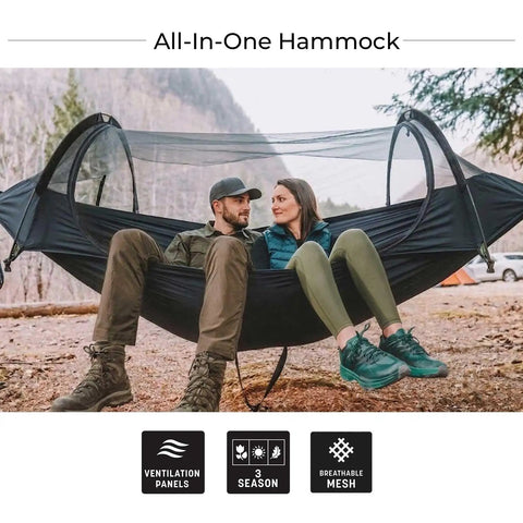 Couple relaxing in Flat Lay Camping Hammock Tent With Mosquito Net And Rain Fly 3 In 1 Waterproof Lightweight Portable Sleeping Hammock outdoors