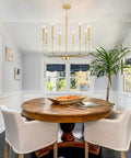 Gold 8 Light Modern Farmhouse Chandelier For Dining Room Kitchen Island Foyer And Living Room Rustic Industrial Candle Pendant Light Fixture With Cupless Candelabra Sockets hanging over dining table