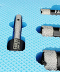 Diamond Core Drill Bit Set For Tiles And Stone - close-up of 8-piece kit showcasing 20mm bit on textured blue background