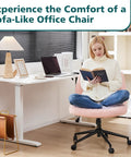 Woman reading on Criss Cross Chair With Wheels Wide Cross Legged Desk Vanity Chair In Teddy Pink in home office