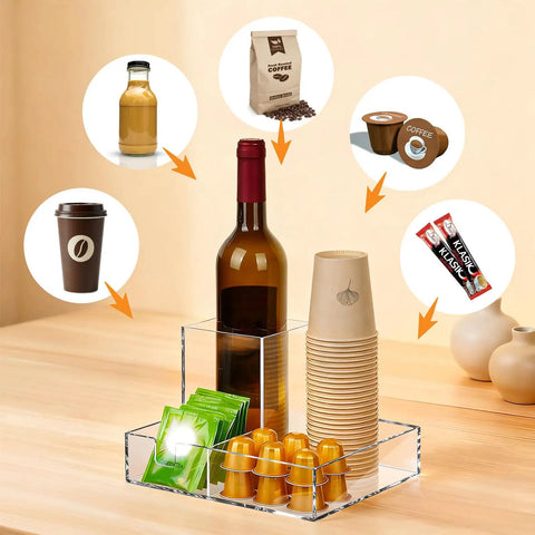 Clear Acrylic Coffee Cup Holder For Countertop With Three Compartments For Cups Lids Straws Pods Sugar Packets And Tea Bags A Handy Coffee Bar Organizer For Kitchen Counters featuring wine bottle, sugar, and pods.
