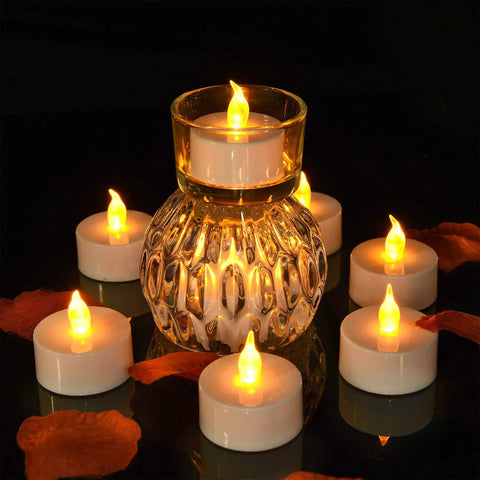 Flameless Tea Light Candles 50 Pack With Batteries Included Realistic Flickering LED Tealights Unscented Battery Operated around glass holder
